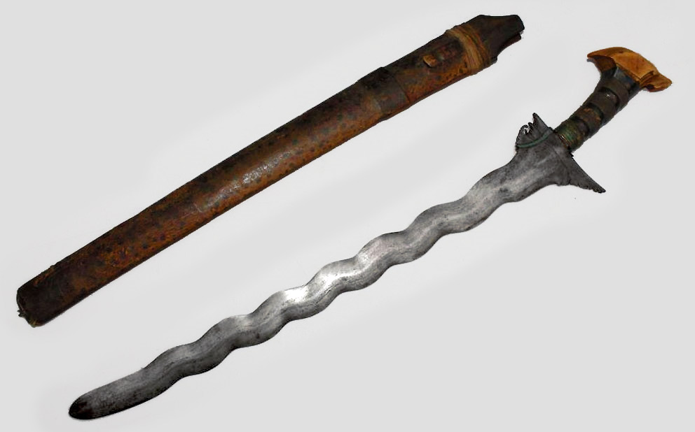 Bone Handled Moro Kris Sword This Bone Handled Moro Kris Sword measures at 26 inches as well. The blade shares the same “wavy” design as the last sword. The bone handle of this Moro Kris Sword is slightly curved with a decorative end piece.